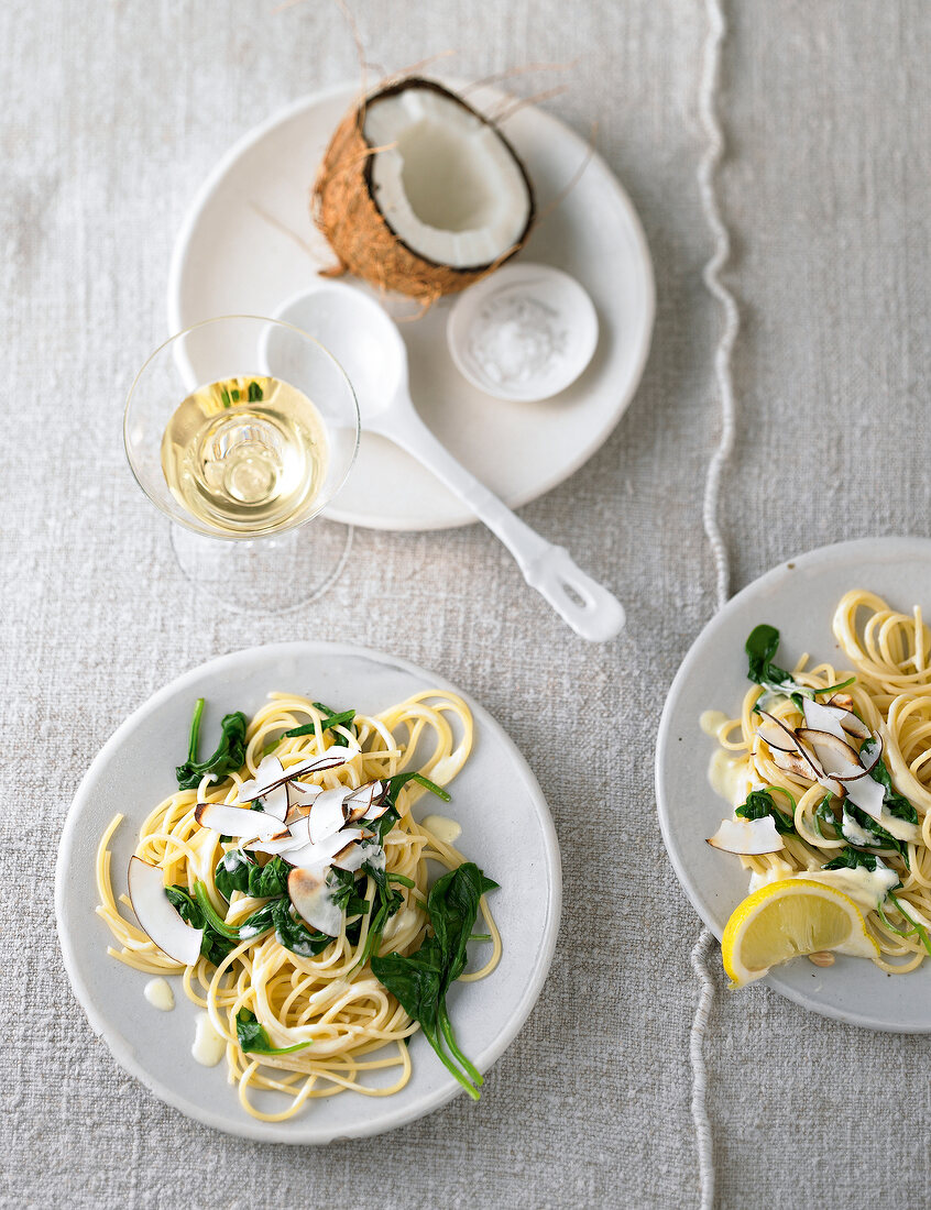 Lemon spaghetti with coconut on plate, overhead view