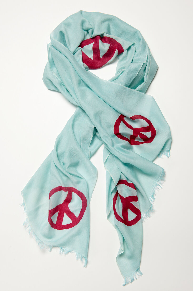 Turquoise colour pashmina cloth with pink peace sign on white background