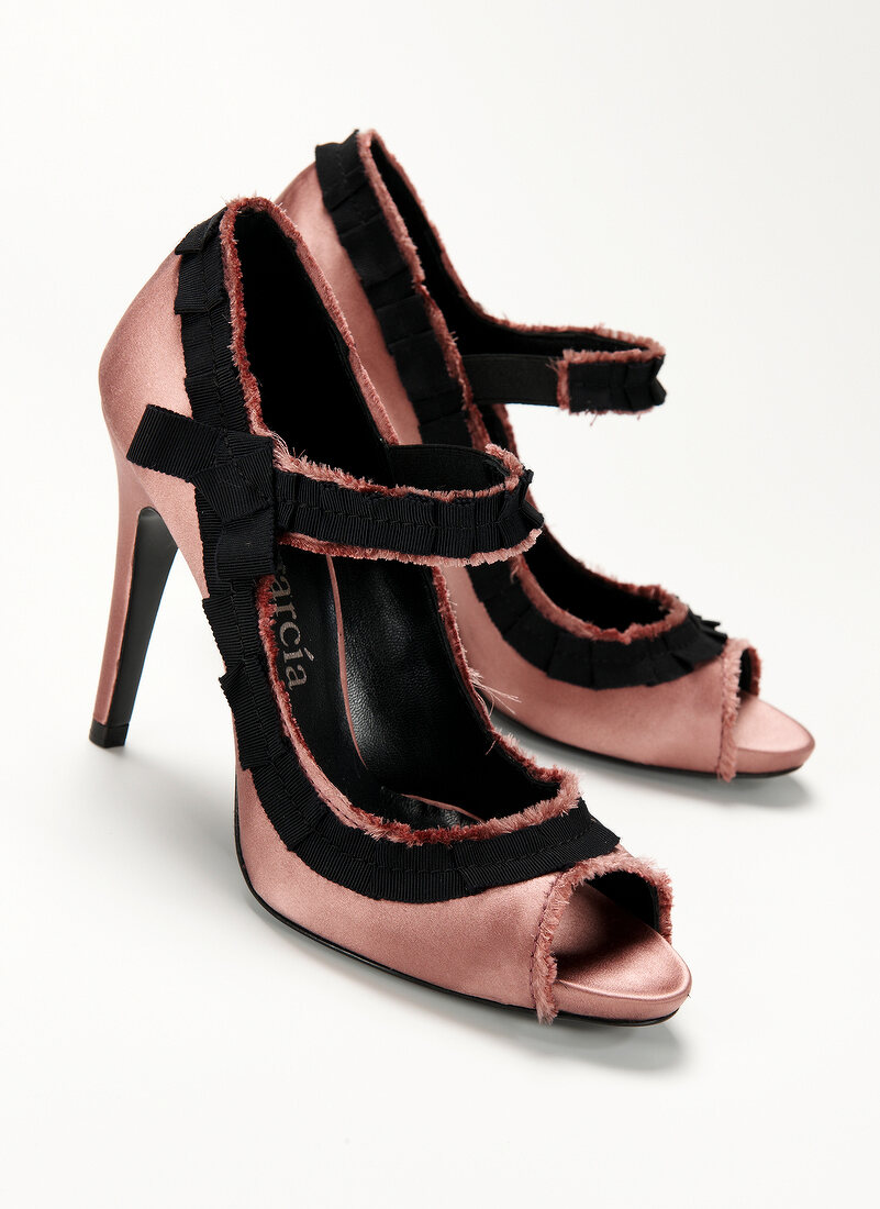 Peep-toes in dusty pink with black fringe and corded ribbon
