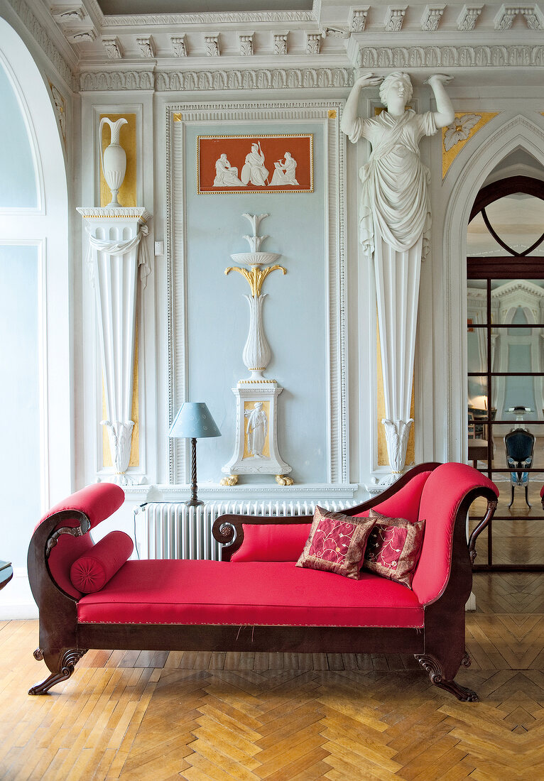 View of red sofa in hall of Castle Gaussig, Saxony, Germany