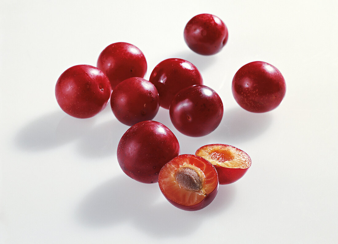 Plums on white background