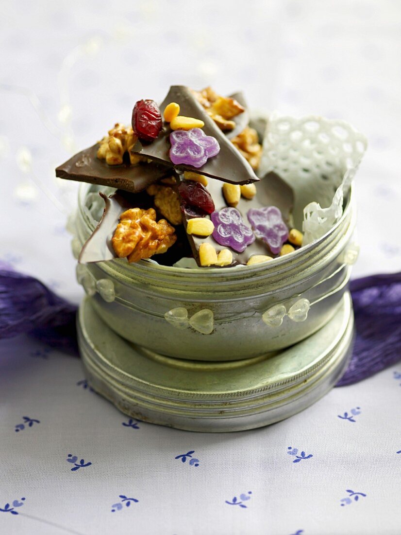 Chocolate with violets, nuts, cranberries and pine nuts