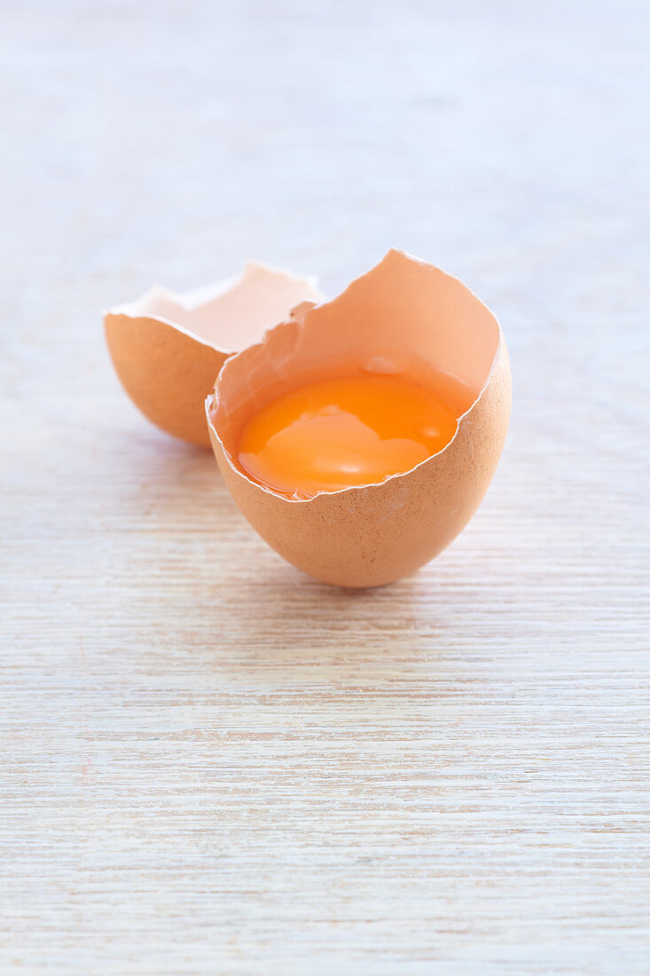 Raw egg in broken shell