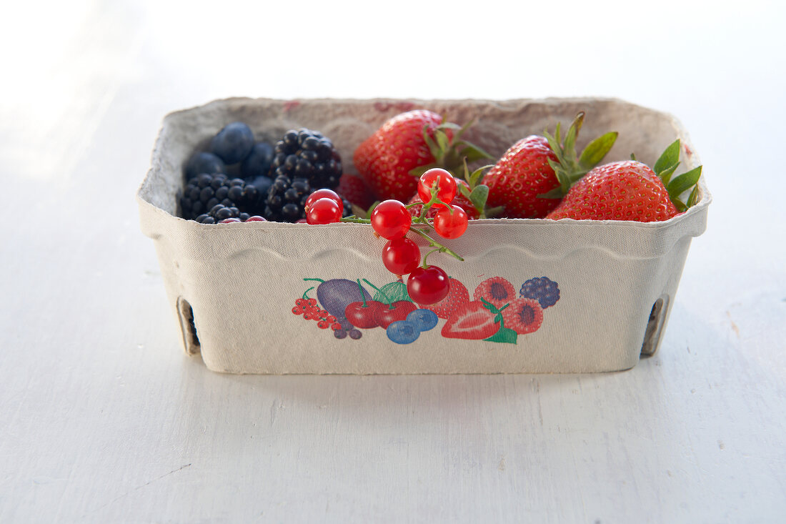 Various fresh berries in carton box