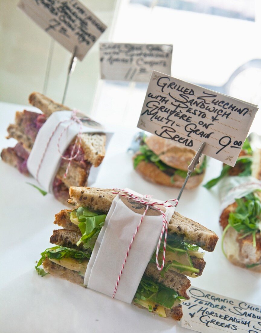 Various sandwiches with price labels