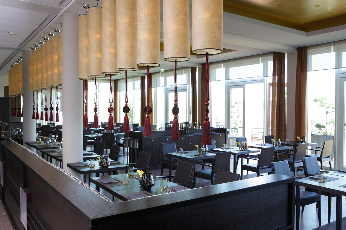 Tables and chairs with lanterns at Hotel A-Rosa, Sylt Island, Schleswig-Holstein, Germany