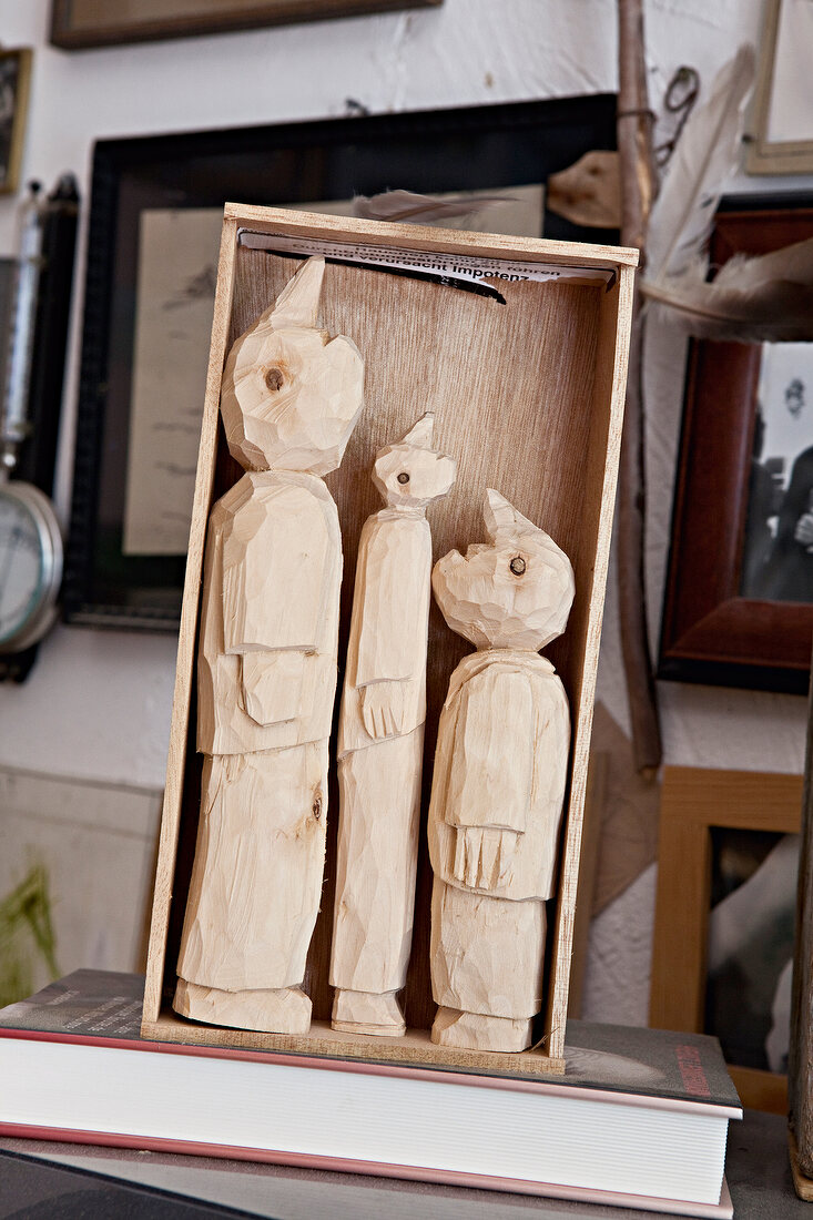 Three figures carved in wooden box, Bremen, Germany