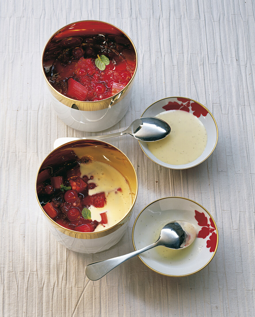 Red fruit jelly and rode grutt with vanilla sauce in serving bowls