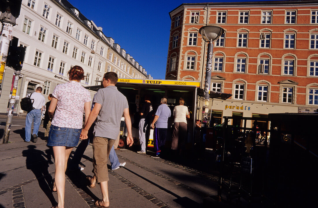 Rear view of people walking on streets of Vesterbro, Denmark