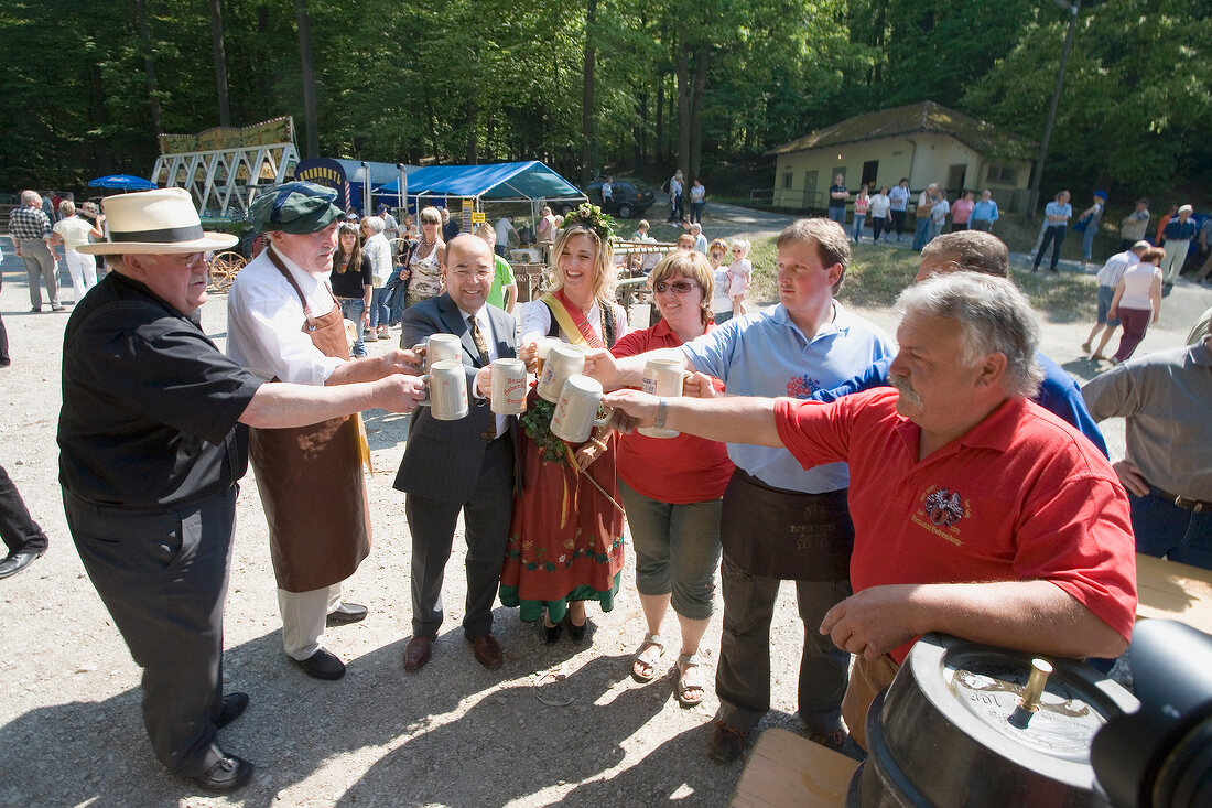 People toasting in Franconian Switzerland, Bavaria, Germany