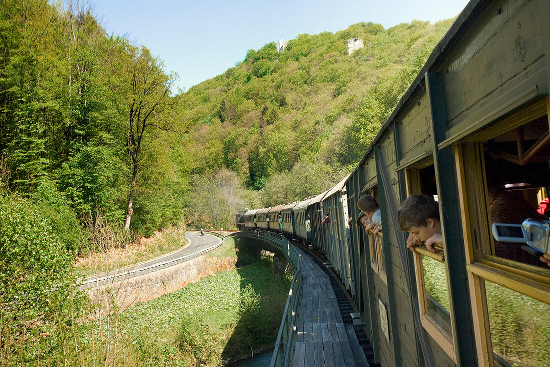 Train passing through Nature Park in Franconian Switzerland, Bavaria, Germany