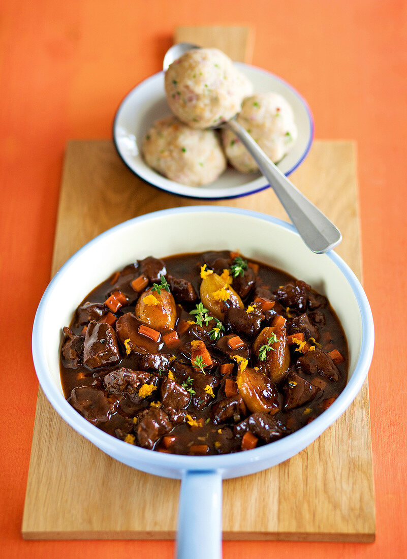 Close-up of venison with tyrolean bacon dumplings in bowl