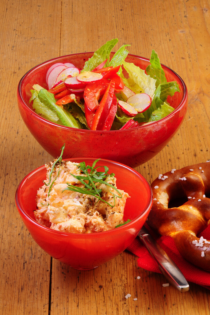 Bavarian cheese with peppers and radish salad in bowls 