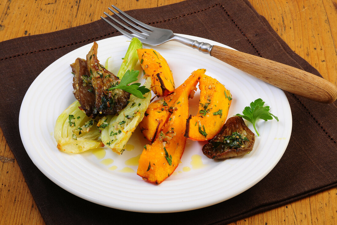 Roasted pumpkin, fennel and oyster mushrooms on plate