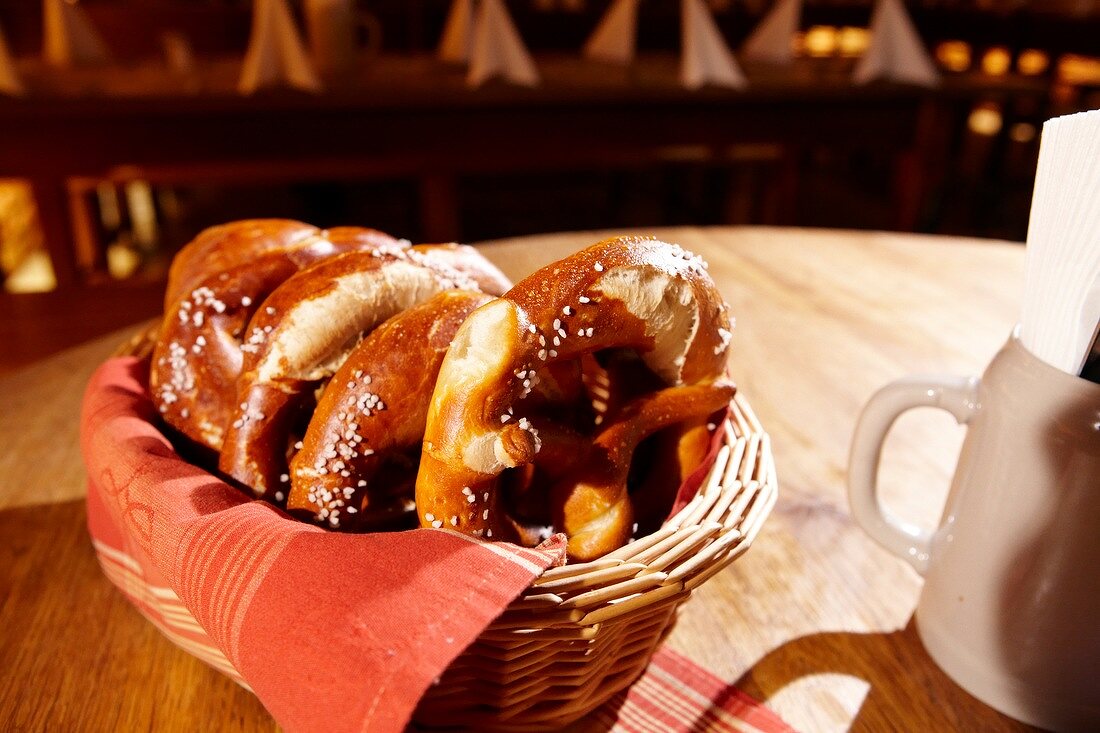 Basket of pretzels on wooden table