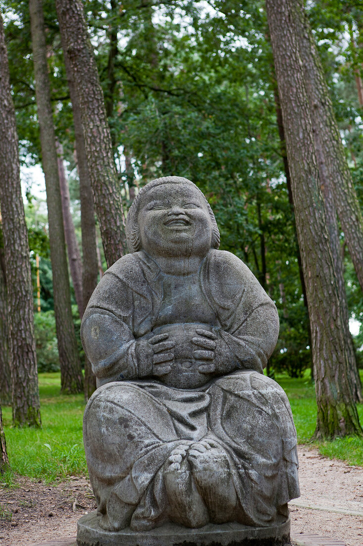 Stone Buddha statue in garden
