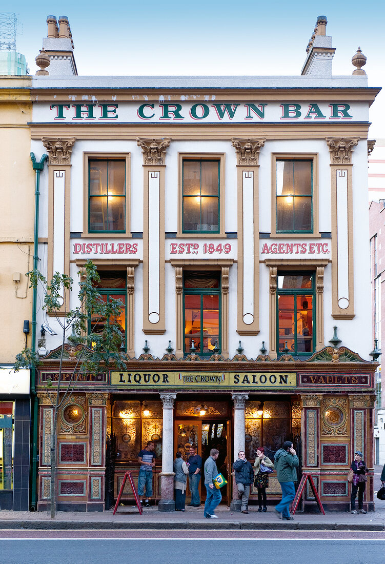 People at entrance of The Crown Bar, Belfast, Ireland