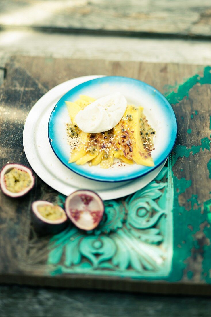 Mango gratin with coconut ice cream and passion fruit