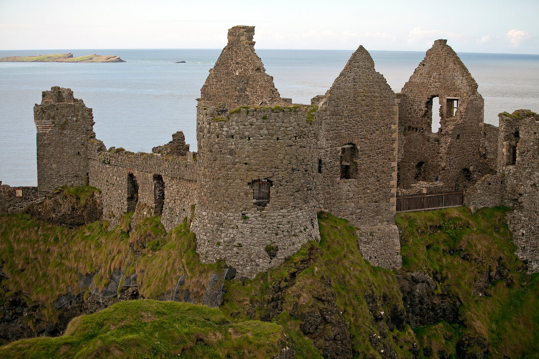 View of Dunluce Castle and Atlantic Ocean in Ireland, UK