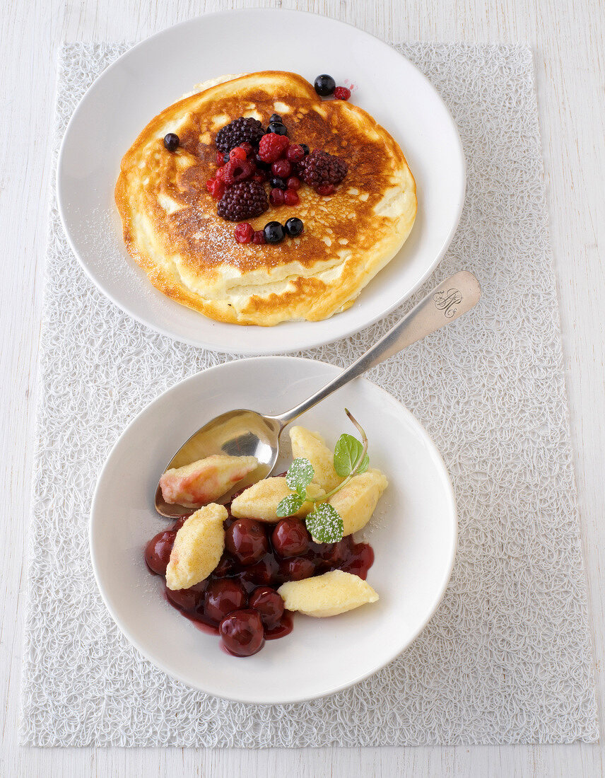 Quark omelette with berries and quark dumplings on plate