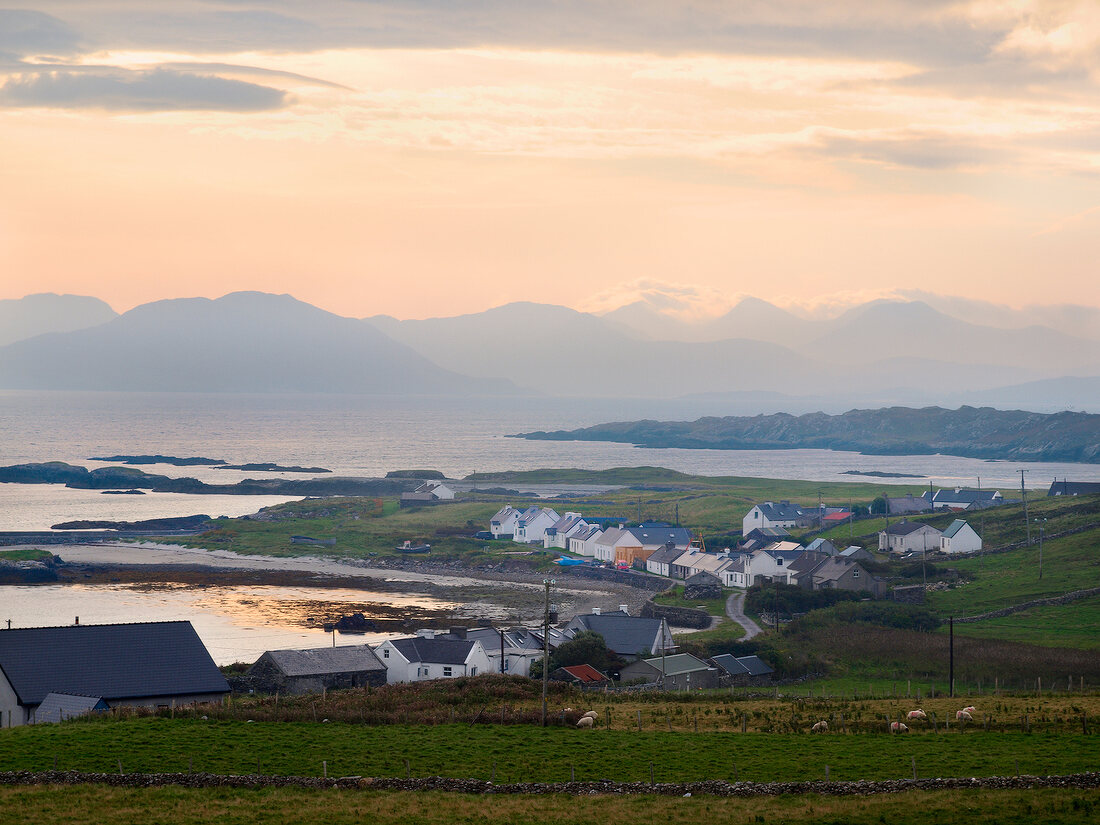 View of mountains, sea and coastal village of Inishbofin, Ireland