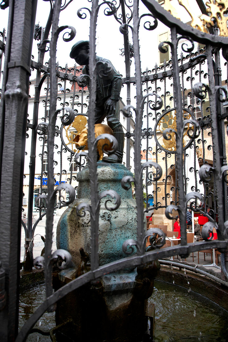 Low angle view of Sculpture of Hans in Luck fountain in Stuttgart, Germany