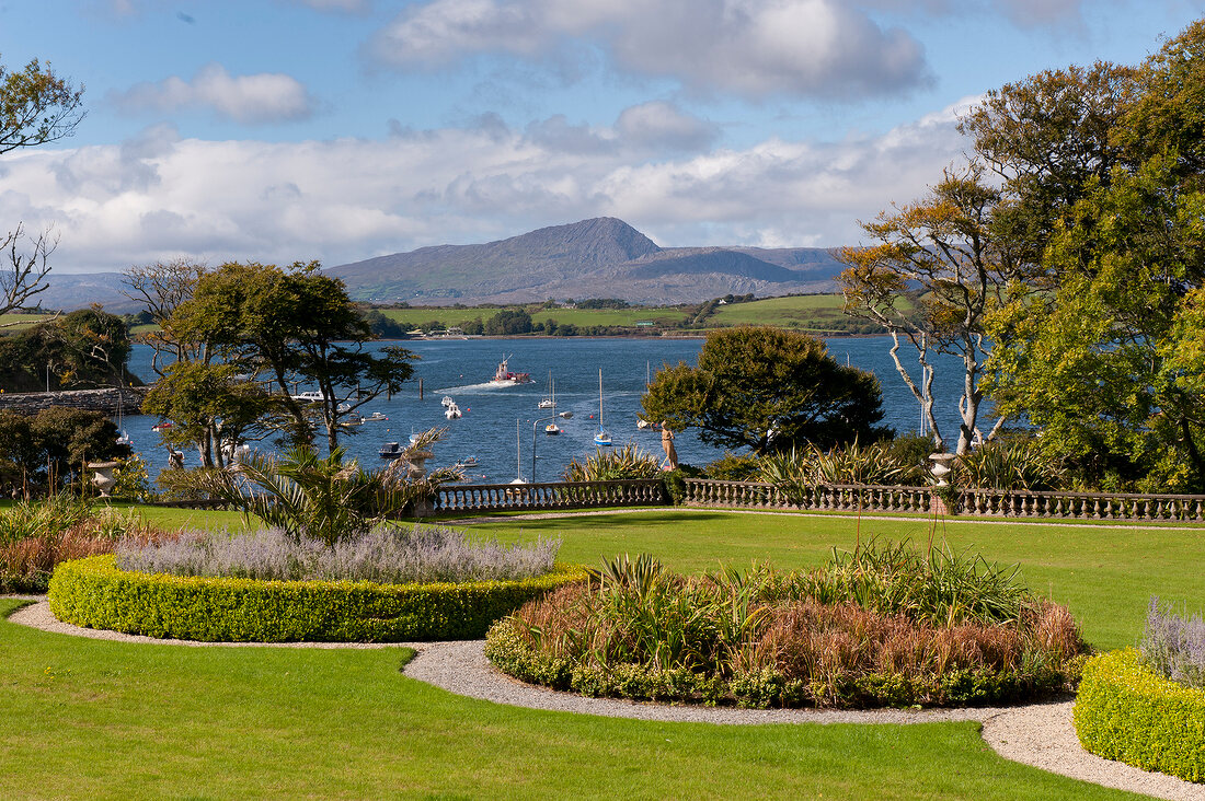 View of front garden in Bantry House with sea in background, Ireland, UK