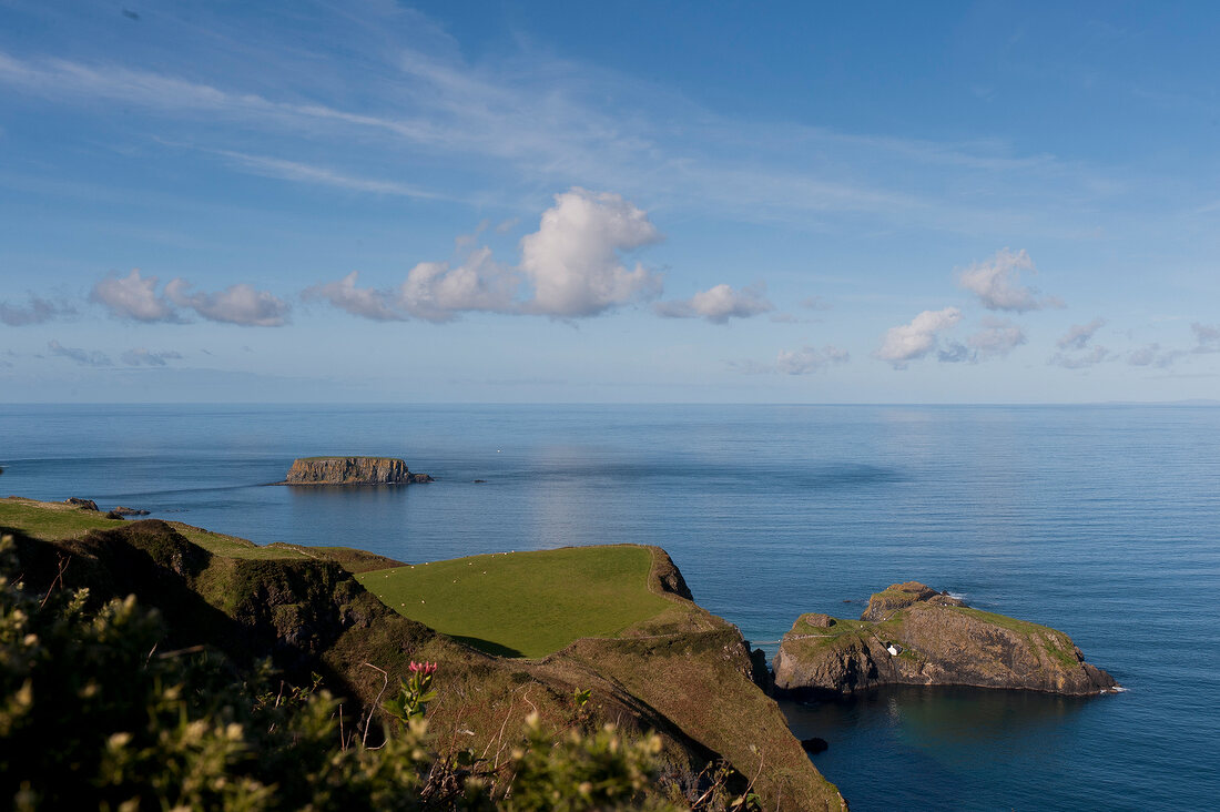 View of Antrim coast and Carrick-a-Rede Rope Bridge, Ireland, UK