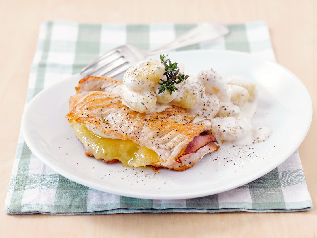 Stuffed cutlets with gnocchi on plate