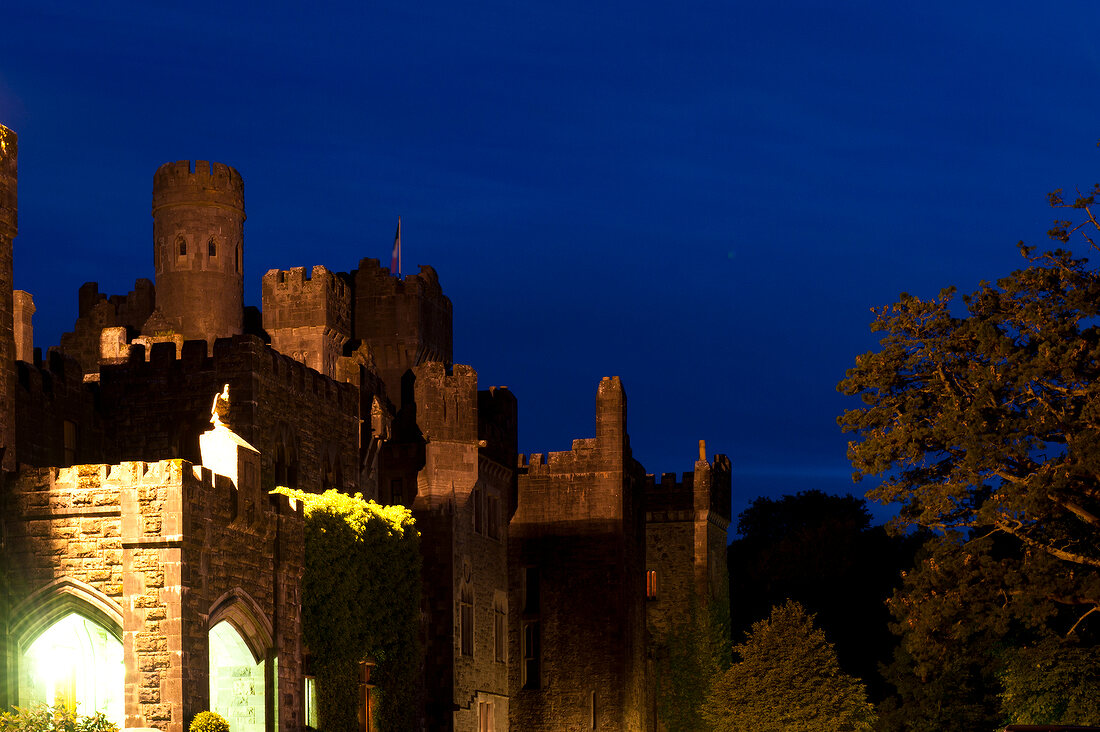 View of Ashford Castle and blue sky at dusk, Ireland, UK