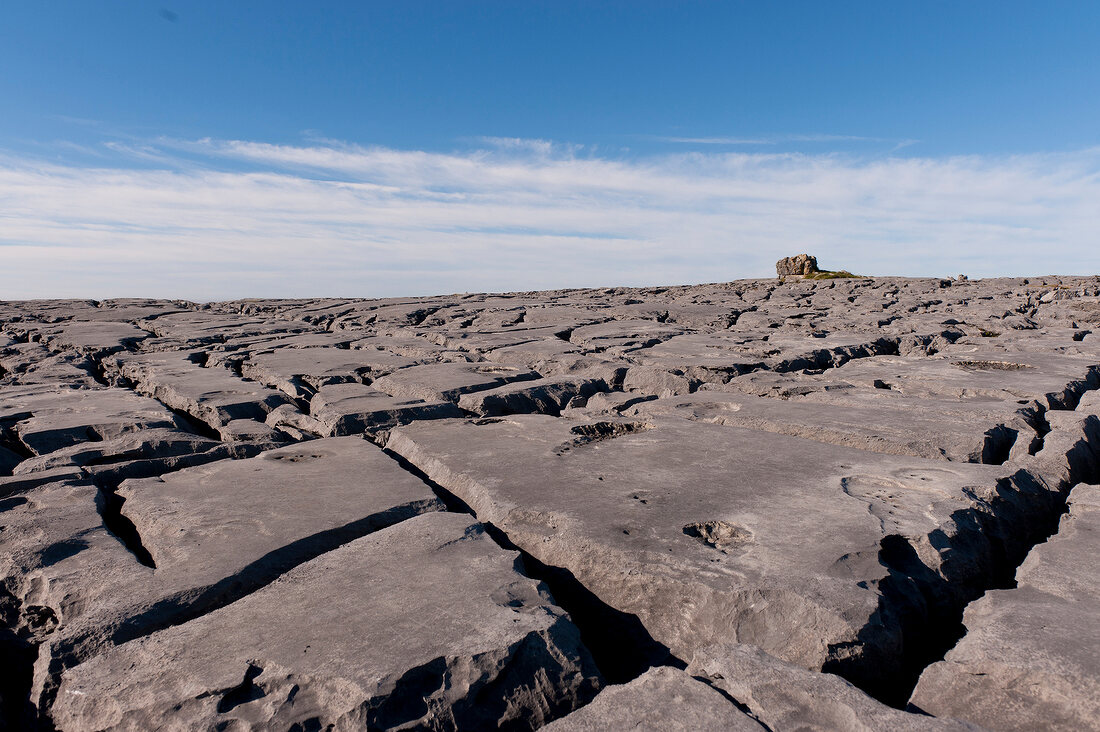 View of barren landscape and blue sky in County Clare, Ireland