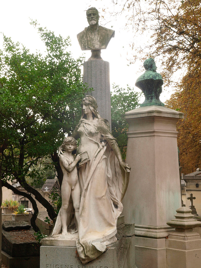 Statue of woman with children in Pere Lachaise Cemetery, Paris