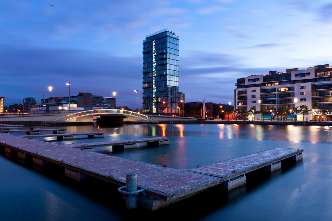 Grand Canal Quaty building with dock lights at night in Dublin, Ireland