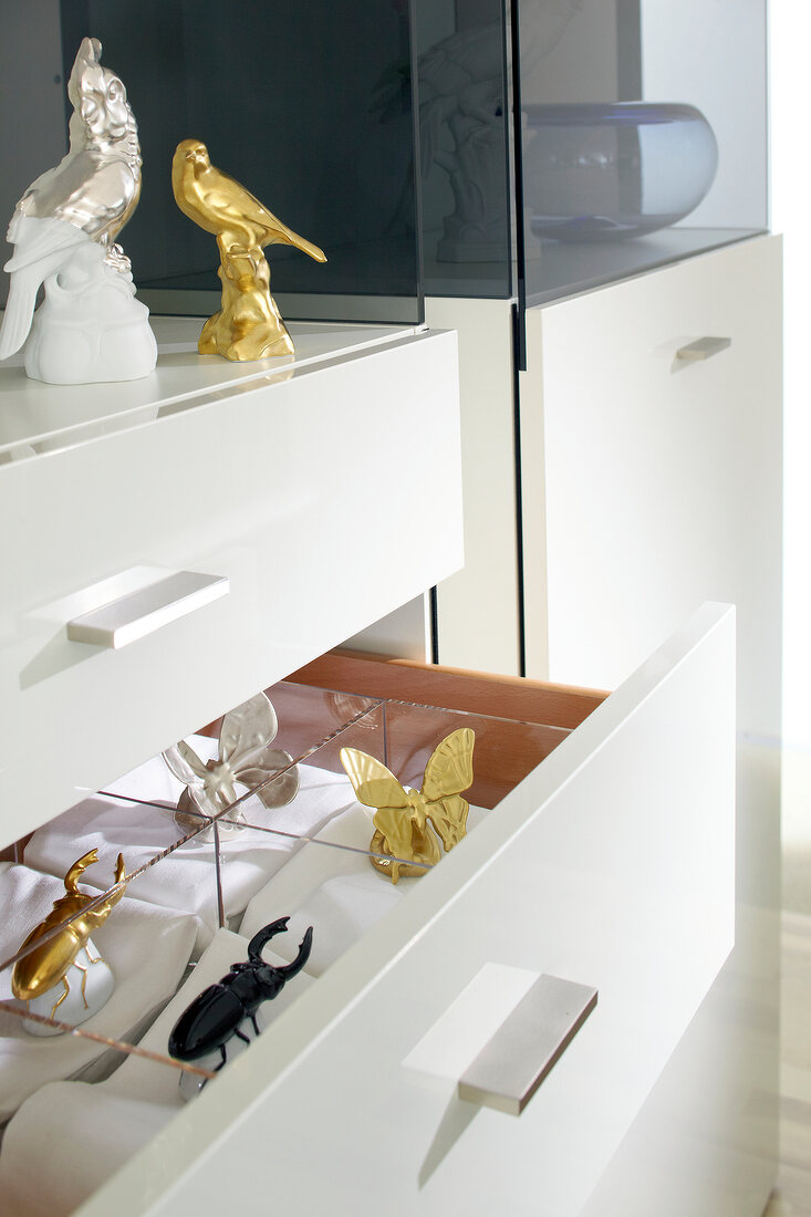 View of open drawer with animal figurine collections