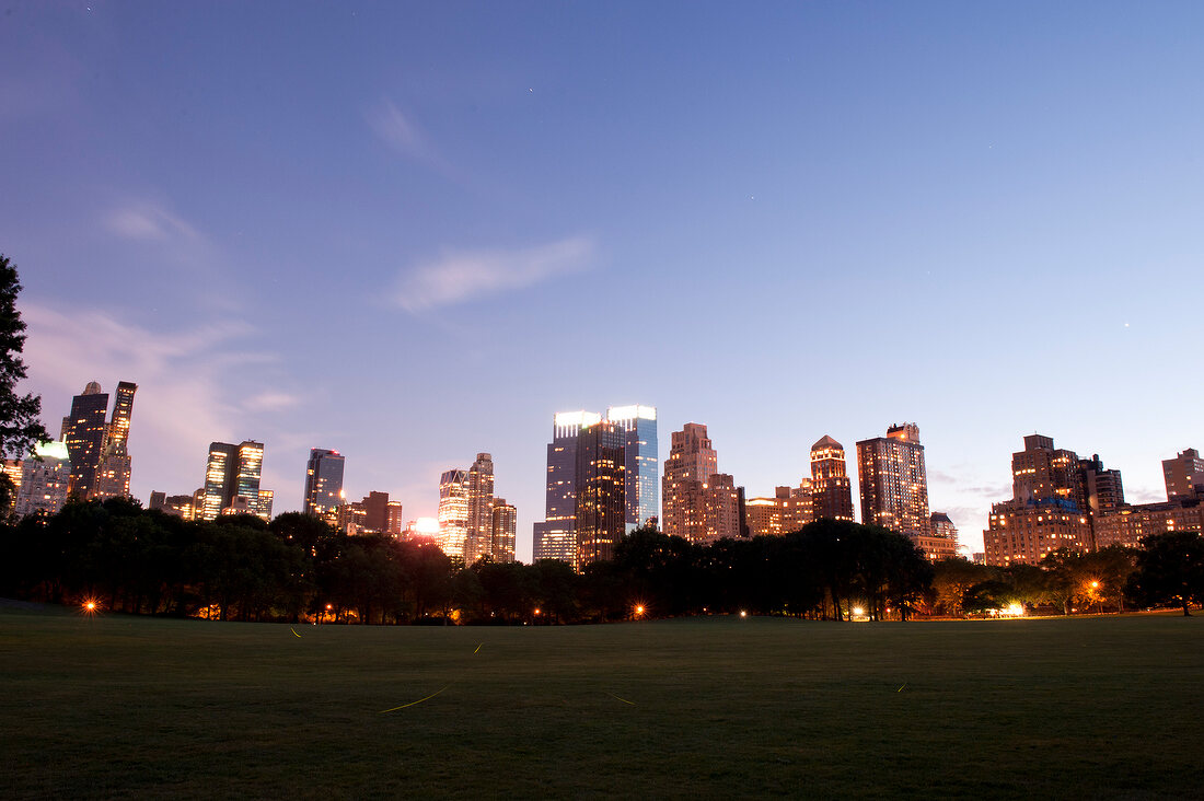 View of skyline and Central park at night in New York, USA