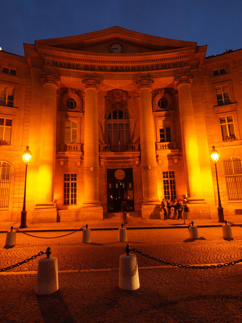 Illuminated Pantheon facade at night in Paris, France