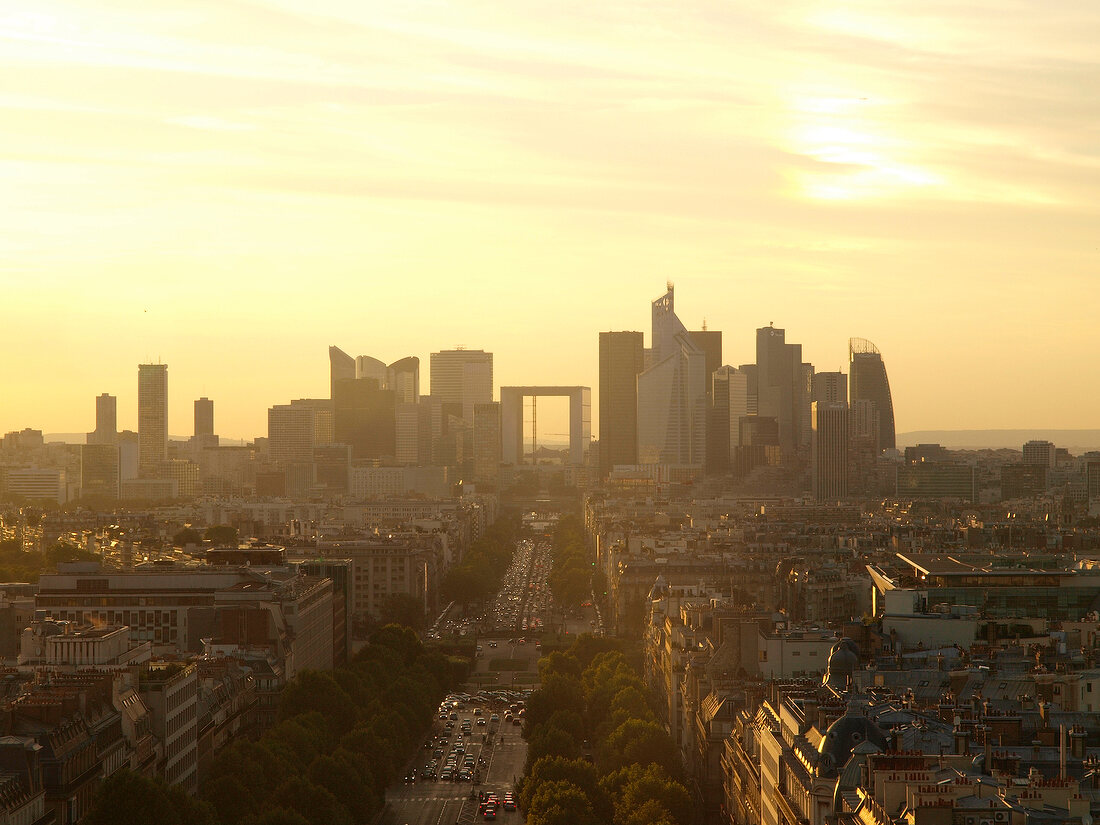 View of La Defence skyscrapers and cityscape at sunset in Paris, France