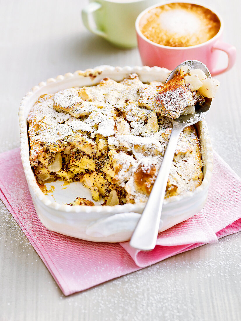 Pear bread pudding with poppy seeds in casserole