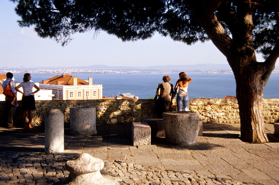 Tourist on terrace of Castle of Sao Jorge in Portugal