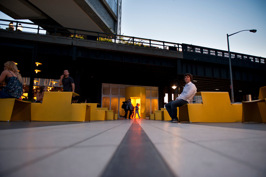 People at entrance of The Standard hotel in New York, USA