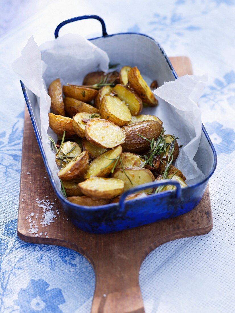 Roast potatoes with rosemary in a baking dish