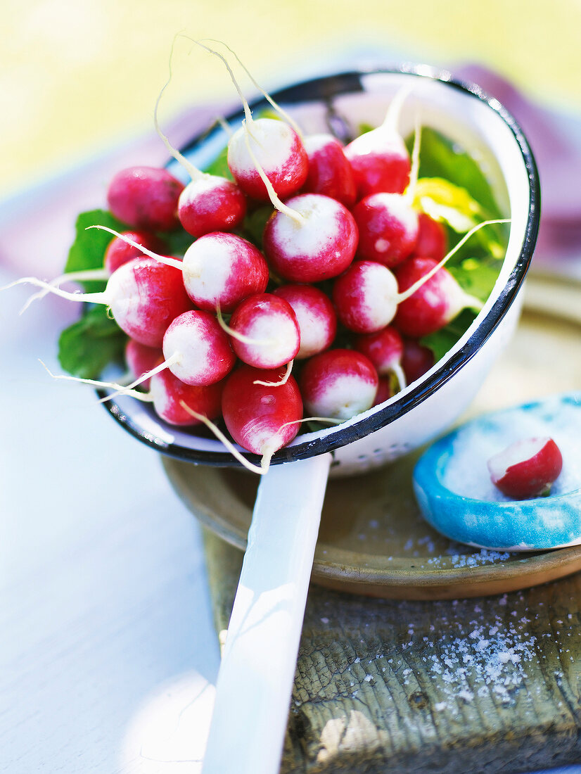 Close-up of bunch of radishes in strainer