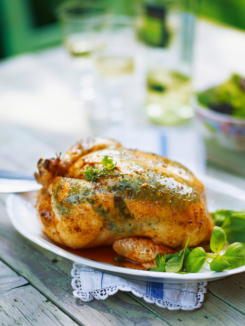 Herb roasted chicken in serving dish