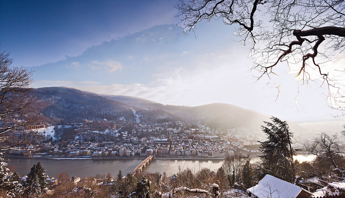 View of cityscape and river Neckar overlooking mountain in winter, Heidelberg, Germany