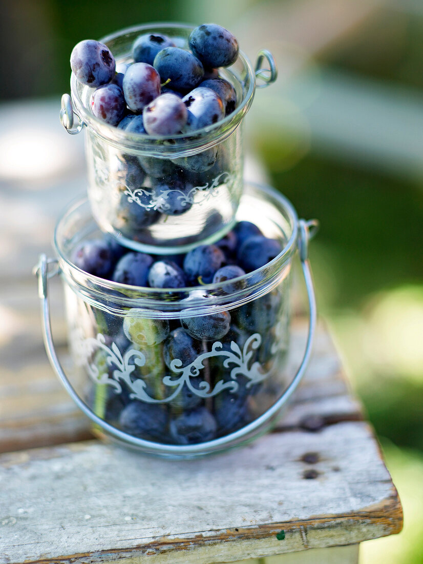 Blueberries in glass jar on table