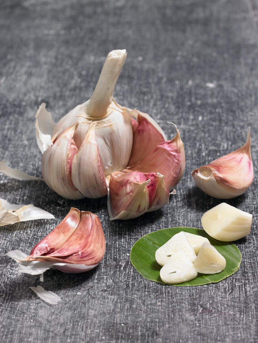 Close-up of cloves of garlic on gray background