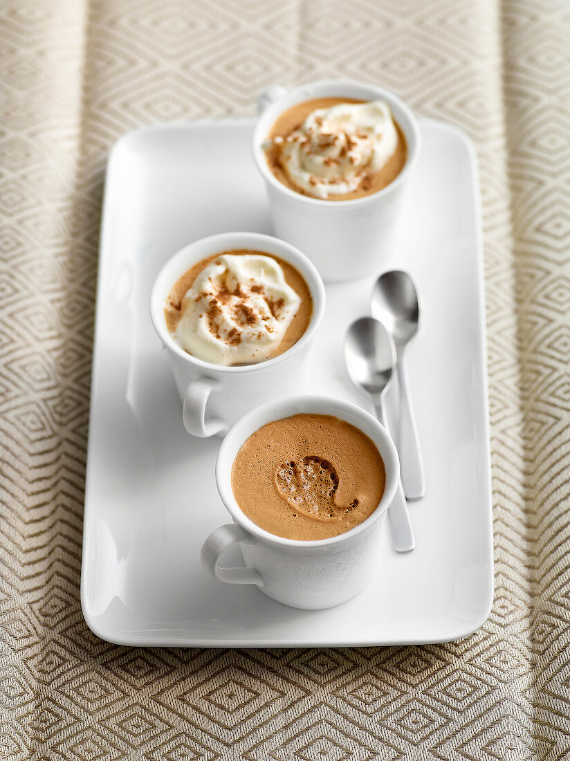 Cup of classic iced coffee on tray