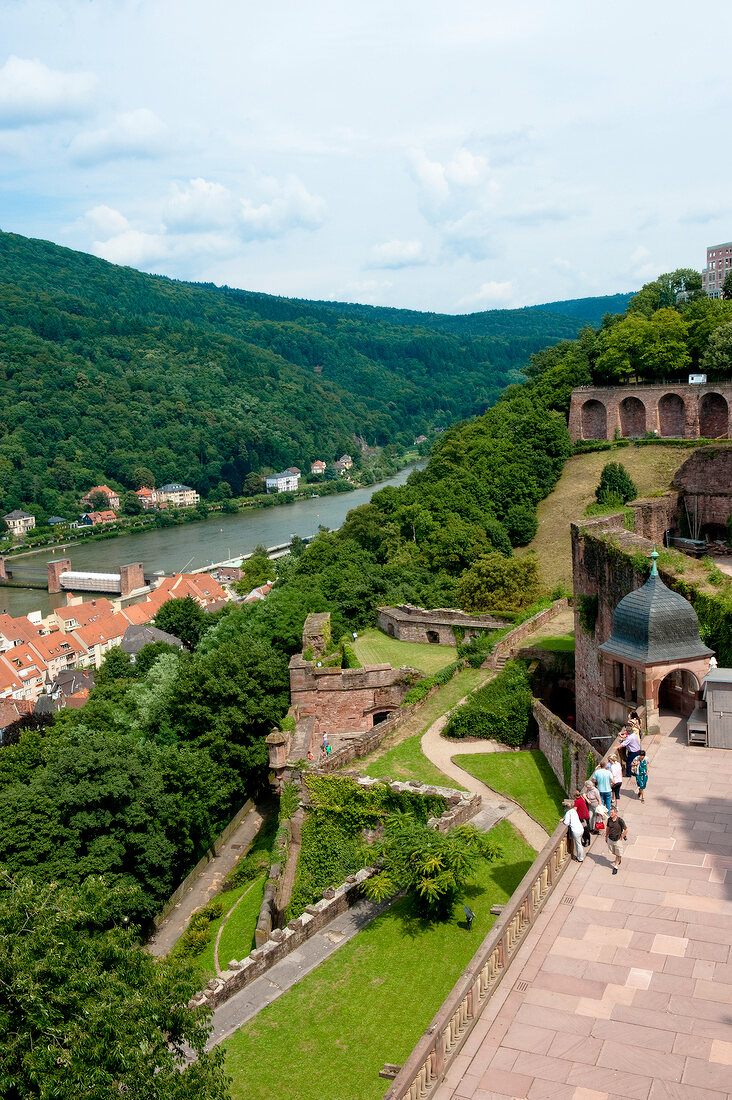 People standing at Heidelberg castle overlooking river Neckar, Germany