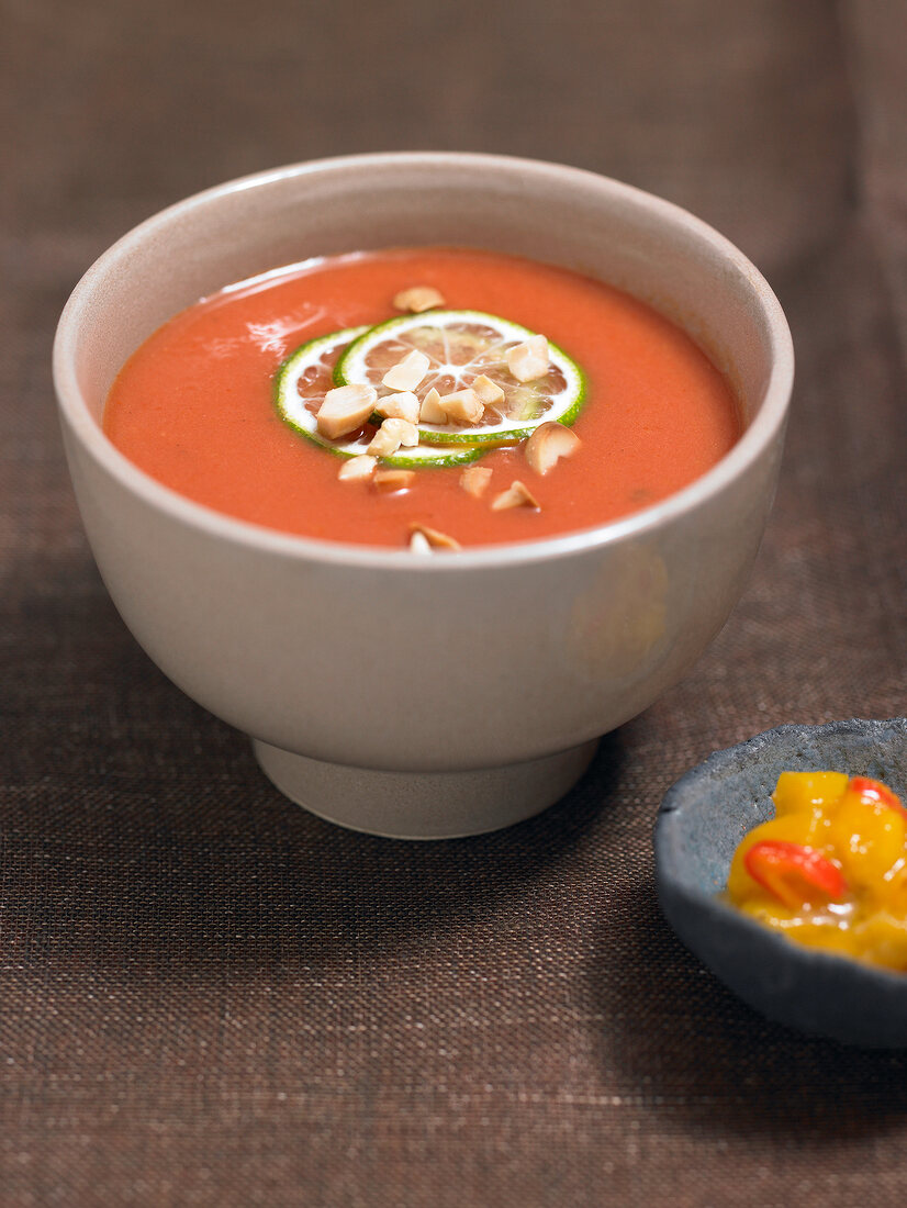 Tomato and coconut soup in bowl