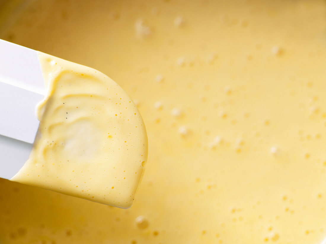 Close-up of rubber spatula with cream